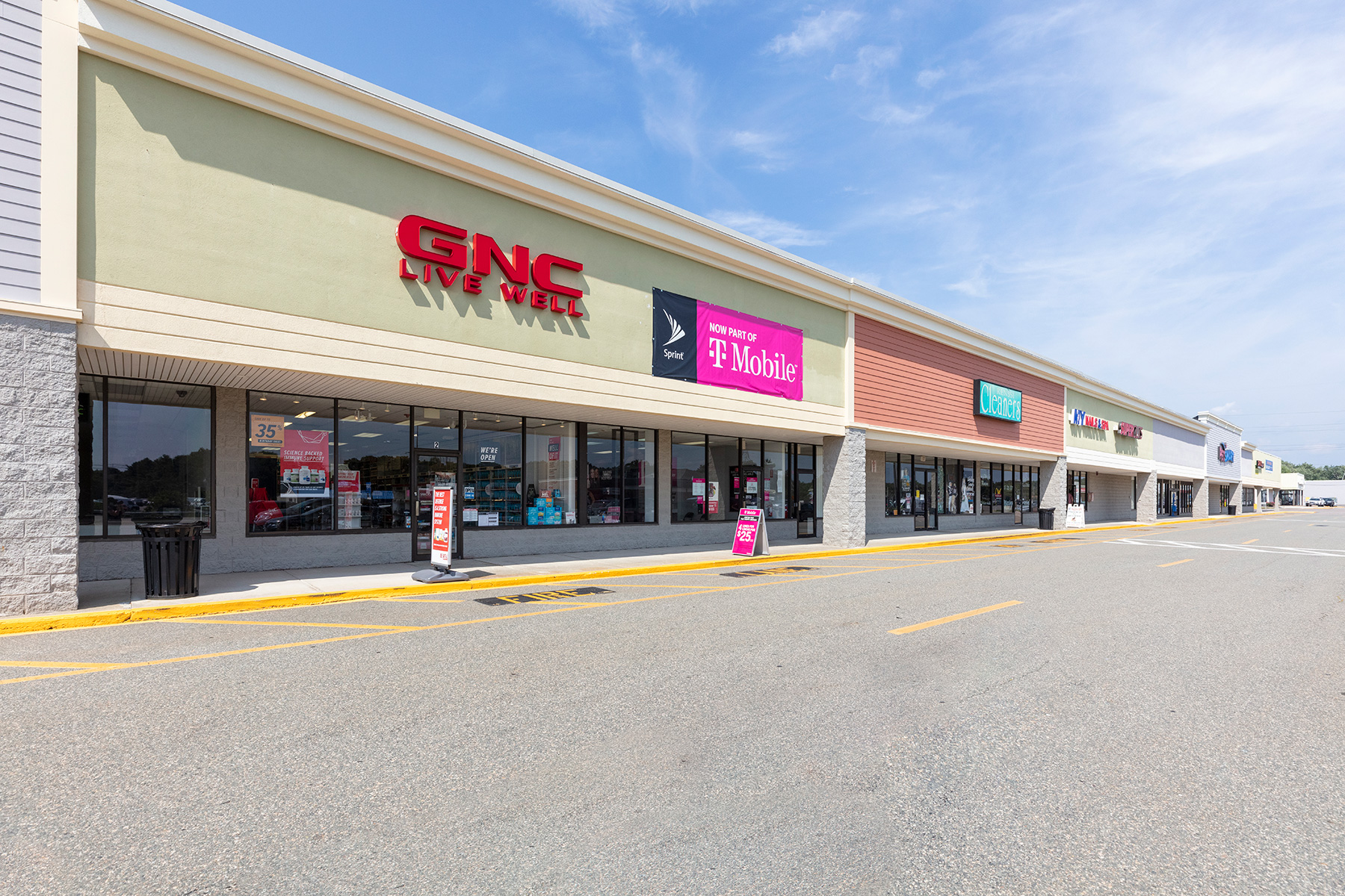 Facade of GNC and other stores in Shaws Plaza